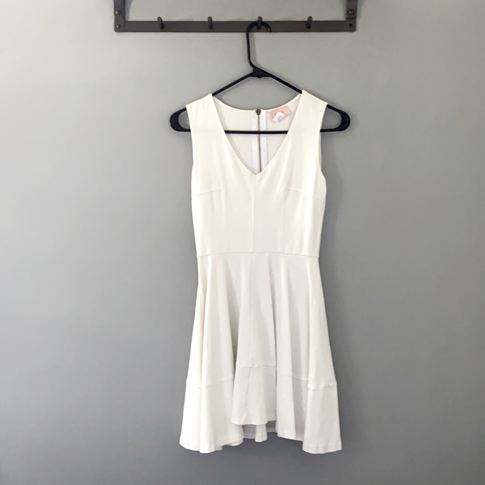 Super cute white mini dress. Sleeveless V cut
